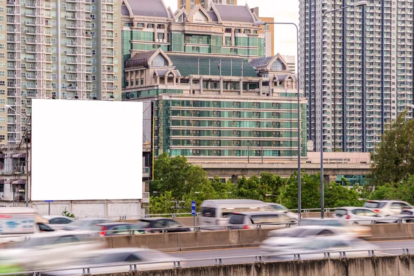 Blank billboard ready for new advertisement on road with city vi — 图库照片