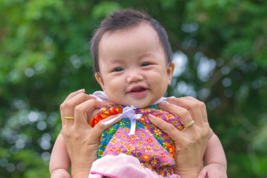 Portrait of happy baby at public park outdoor