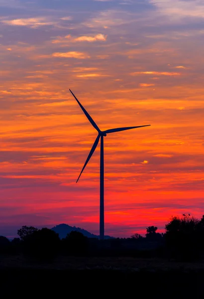 Eco power in wind turbine farm with sunset — Stock Photo, Image