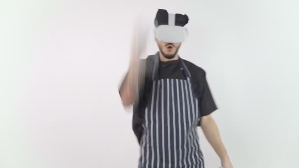 Chef Wearing Virtual Reality Headset using controllers slashing around with hands — 图库视频影像