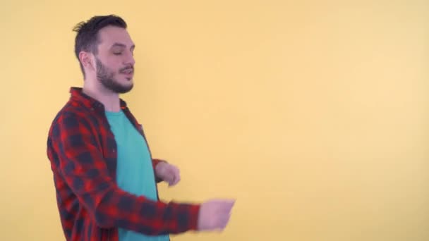 Joyful Young Man Dancing Moving Arms and Body in Studio — Stok Video