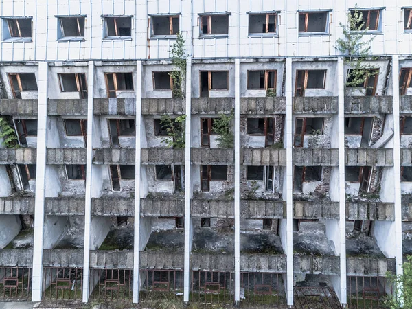 Abandoned hotel with trees coming out drone view — Stock Photo, Image