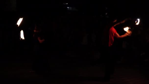Troyan, Bulgaria-06 09 2021: Fire dance duet at fire performance show in the dark — 비디오