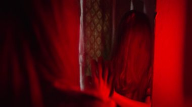 Vertical Terrifying Ghostly Woman Looking at Her Reflection in Old Dusty Mirror in Abandoned House. High quality 4k footage