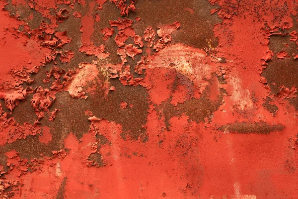 Red, rusty background with peeling paint. — Stock Photo, Image