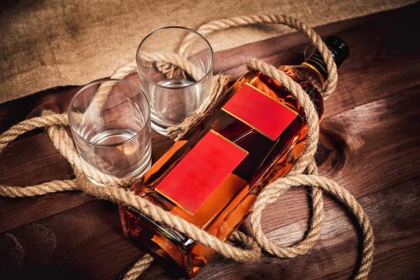 Whiskey aged elite alcohol on wooden background — Stock Photo, Image