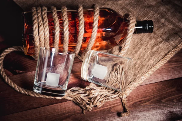 Whiskey aged elite alcohol on wooden background — Stock Photo, Image