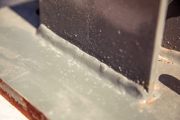 weld steel columns, painted over