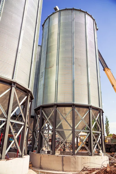 Background, metal barrels granaries on the sky background — Stock Photo, Image