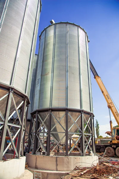 Background, metal barrels granaries on the sky background — Stock Photo, Image