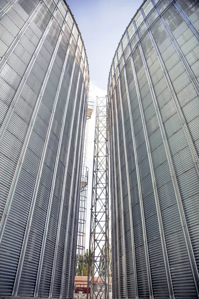 Background, metal barrels granaries on the sky background — Stock Photo, Image