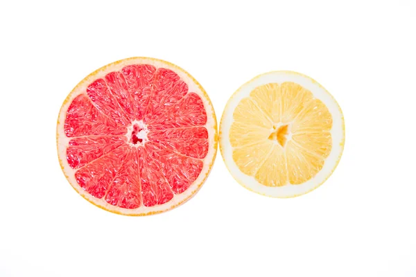 Grapefruit und Zitrone auf weißem Hintergrund, Textur — Stockfoto