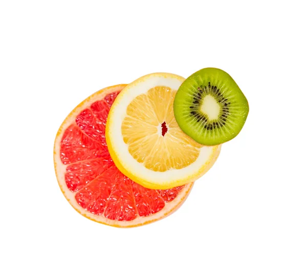 The pedestal of the fruits falling fruit, balance, grapefruit, kiwi, lemon — Stock Photo, Image