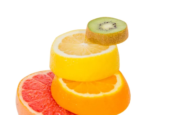 The pedestal of the fruits falling fruit, balance, grapefruit, kiwi, lemon — Stock Photo, Image