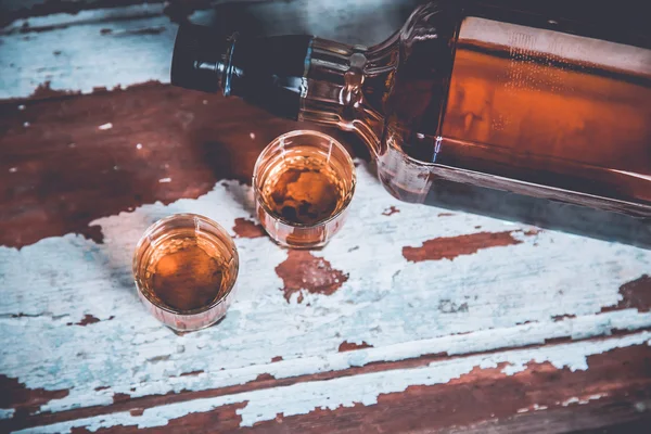 Two glasses of whiskey standing on the bar — Stock Photo, Image