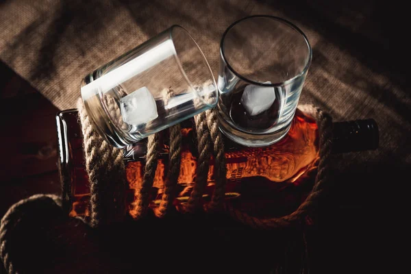 Whiskey stylish photos, brandy and bourbon on the wooden background — Stock Photo, Image