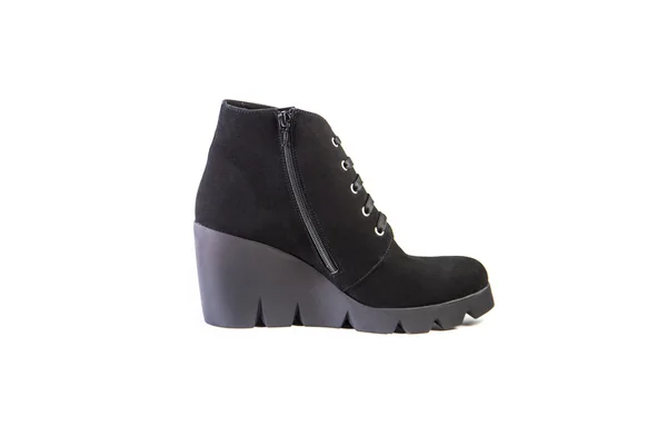 Suede women's boots on a white background, black shoes, autumn and winter, side view — Stock Fotó