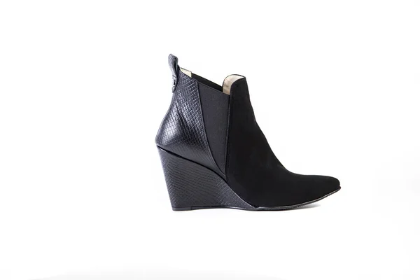 Suede women's boots on a white background, black shoes, autumn and winter, side view — ストック写真