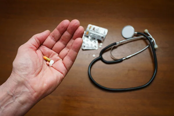 Pills Palm Elderly Person Stethoscope Packaging Pills Table Closeup — Stock Photo, Image