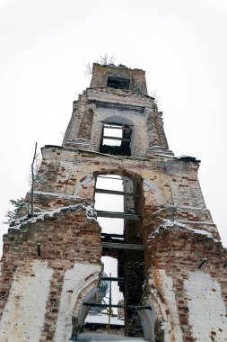 the bell tower was destroyed in the winter Church of the ascension on the river Meuse, in the village of Bychikha, Kostroma oblast, Russia clipart