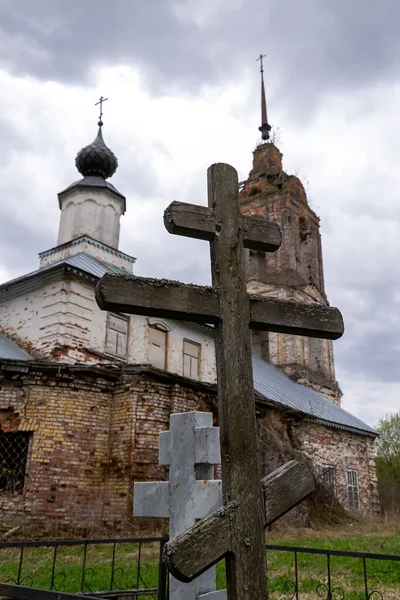 old wooden Orthodox cross on the background of the church