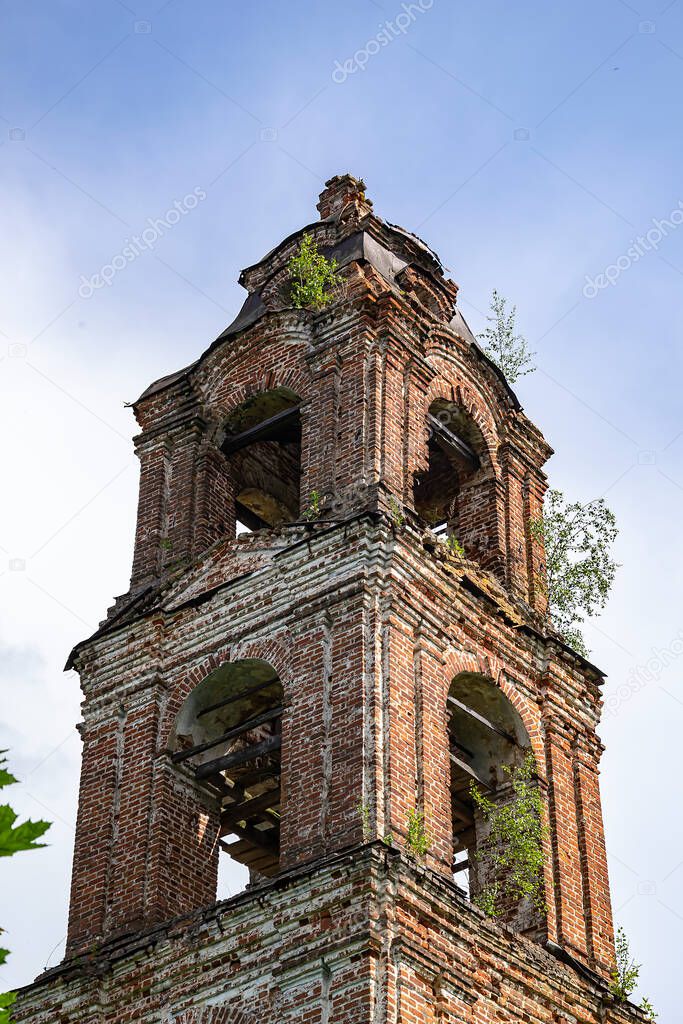 an old abandoned Orthodox bell tower, the village of Sukhorukovo, Kostroma province, Russia. The building was built at the end of the 18th century. Currently, the temple is abandoned.