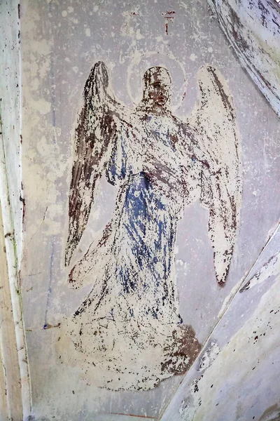 angel, painting of the walls of an Orthodox abandoned church, in poor condition