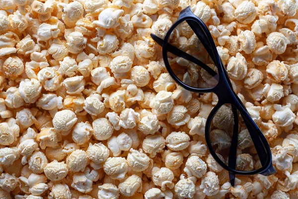 3 D glasses for watching a movie on popcorn background, movie time, place for text — Stock Photo, Image