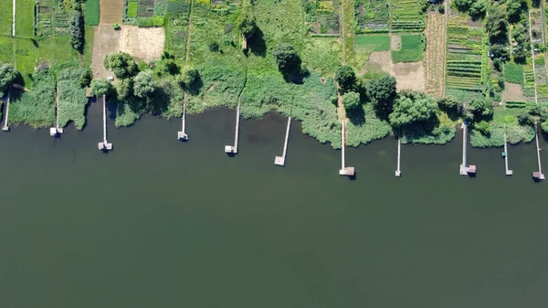 Lake pier, aerial view, photography from a drone. Fishing pier on river top view.