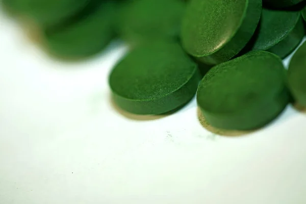 Green pills close up medical spirulina platensis algae family algaespace modern trendy food high quality big size print