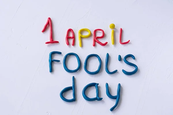 Funny font April Fools Day, written in plasticine. Fools day phrase from plasticine, letters on white background — Stock Photo, Image