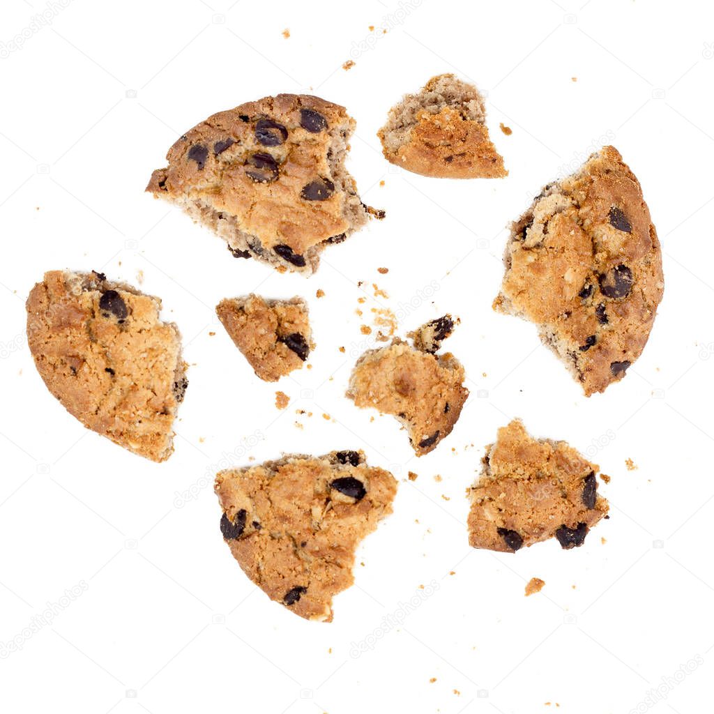 Close up of chocolate chip cookie pieces with crumbs isolated on white background