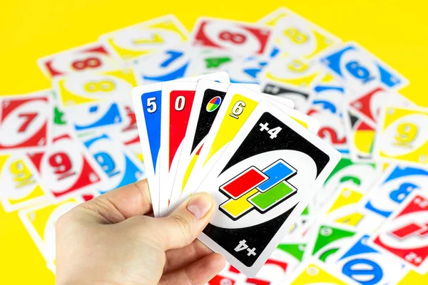 Playing American Card Game Uno, Holding Game Cards in Female Hand