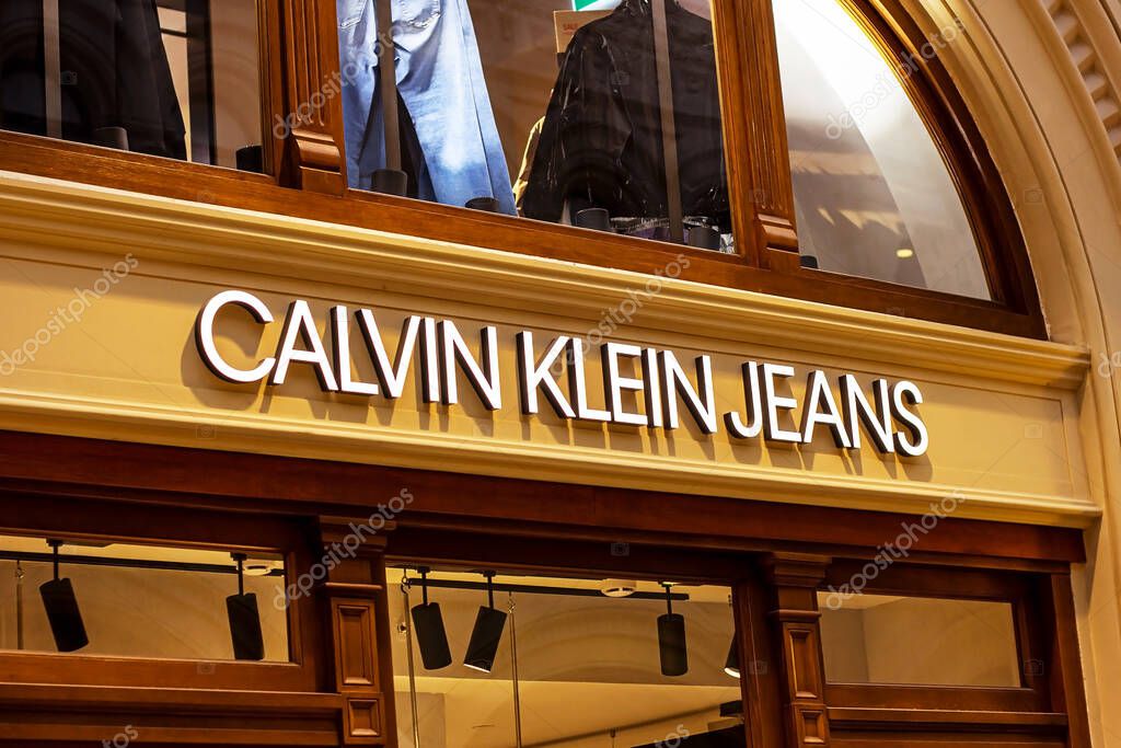 MOSCOW, RUSSIA - AUGUST 10, 2021: Calvin Klein Jeans brand retail shop logo singboard on the storefront in the shopping mall.