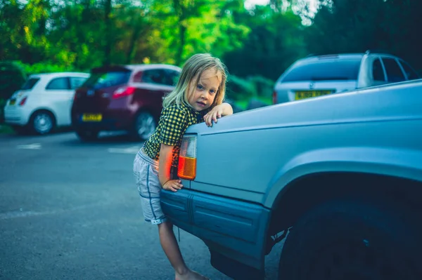 Little Preschooler Climbing Bonnet Car — Stock Photo, Image