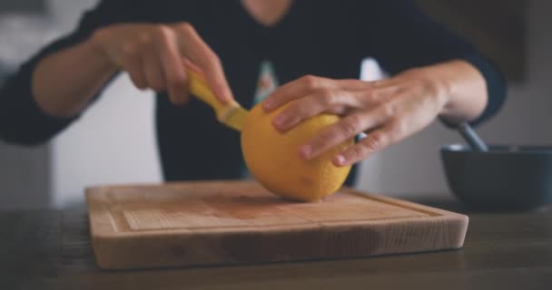Woman Cutting Fresh Orange Home — Stock Video