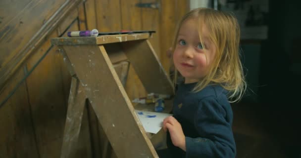 Little Boy Drawing Something Wooden Ladder — Stock Video