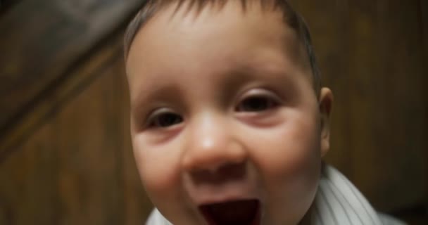 Cute Little Baby Boy Trying Stand Leaning Chair — Stock Video