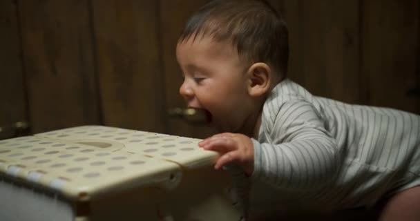 Cute Little Baby Boy Trying Stand Leaning Chair — Stock Video