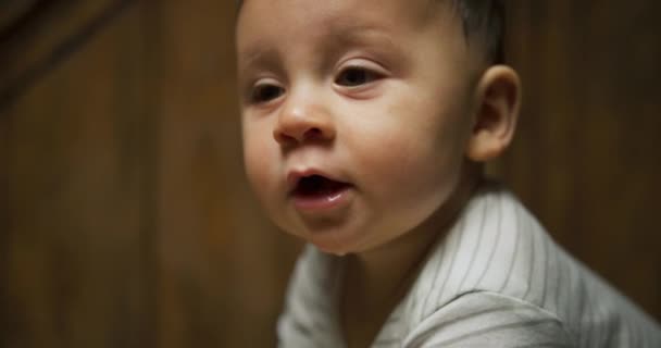 Cute Little Baby Boy Trying Stand Leaning Chair — Stock Video