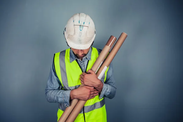 Engineer with building plans — Stock Photo, Image