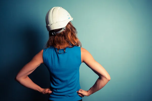 Young woman wearing hard hat — Stock Photo, Image