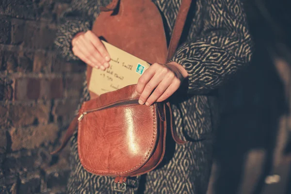 Woman with letter at sunset — Stock Photo, Image