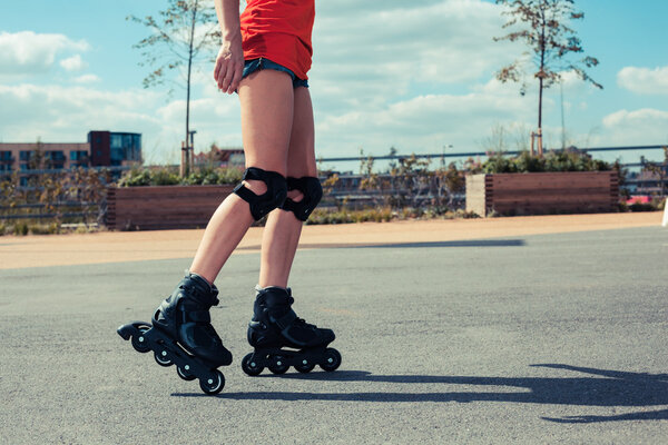 Woman rollerblading on sunny day