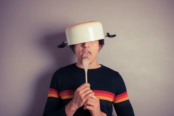 Silly young man with pot on his head — Stock Photo, Image