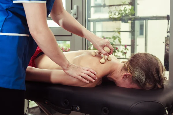 Woman being massaged on a table — Stock Photo, Image