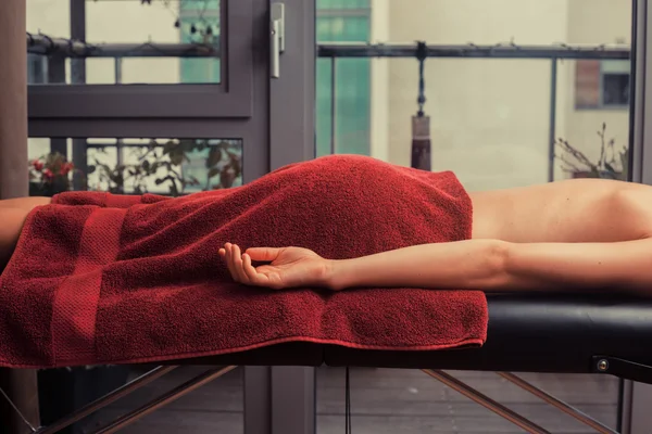 Young woman on massage table