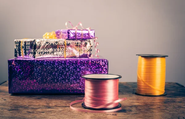 Presents on a wooden table — Stock Photo, Image