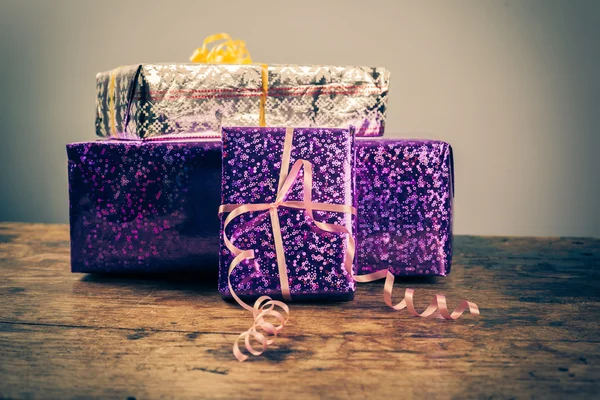 Presents on a wooden table — Stock Photo, Image