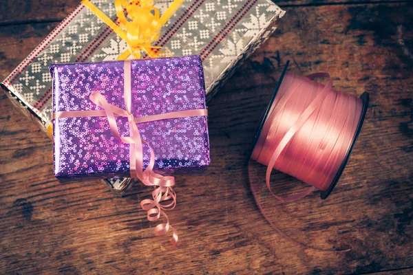 Presents on a wooden table — Stock Photo, Image